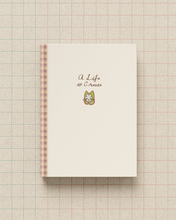 A Life to Create journal with a soft cream cover and a small Mamoo the cat illustration