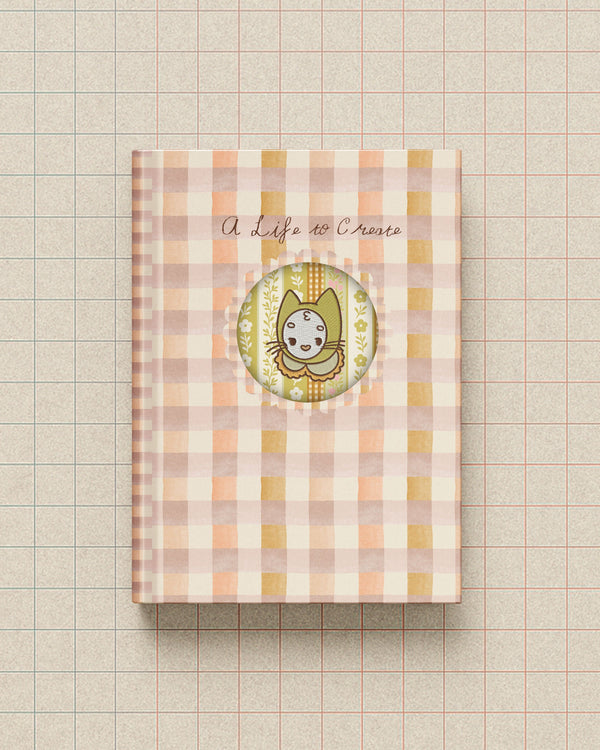 Notebook with a checkered cover and circular design on a grid background